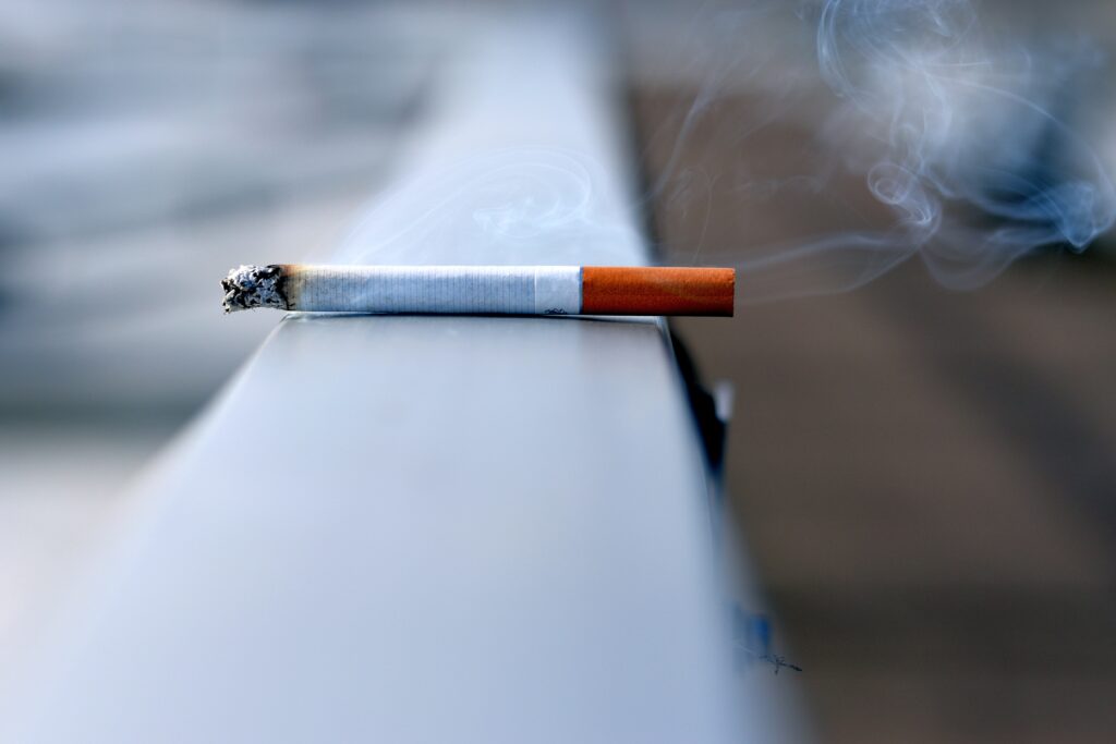 cigarette balancing on rail